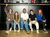 a group of young people posing for a photo